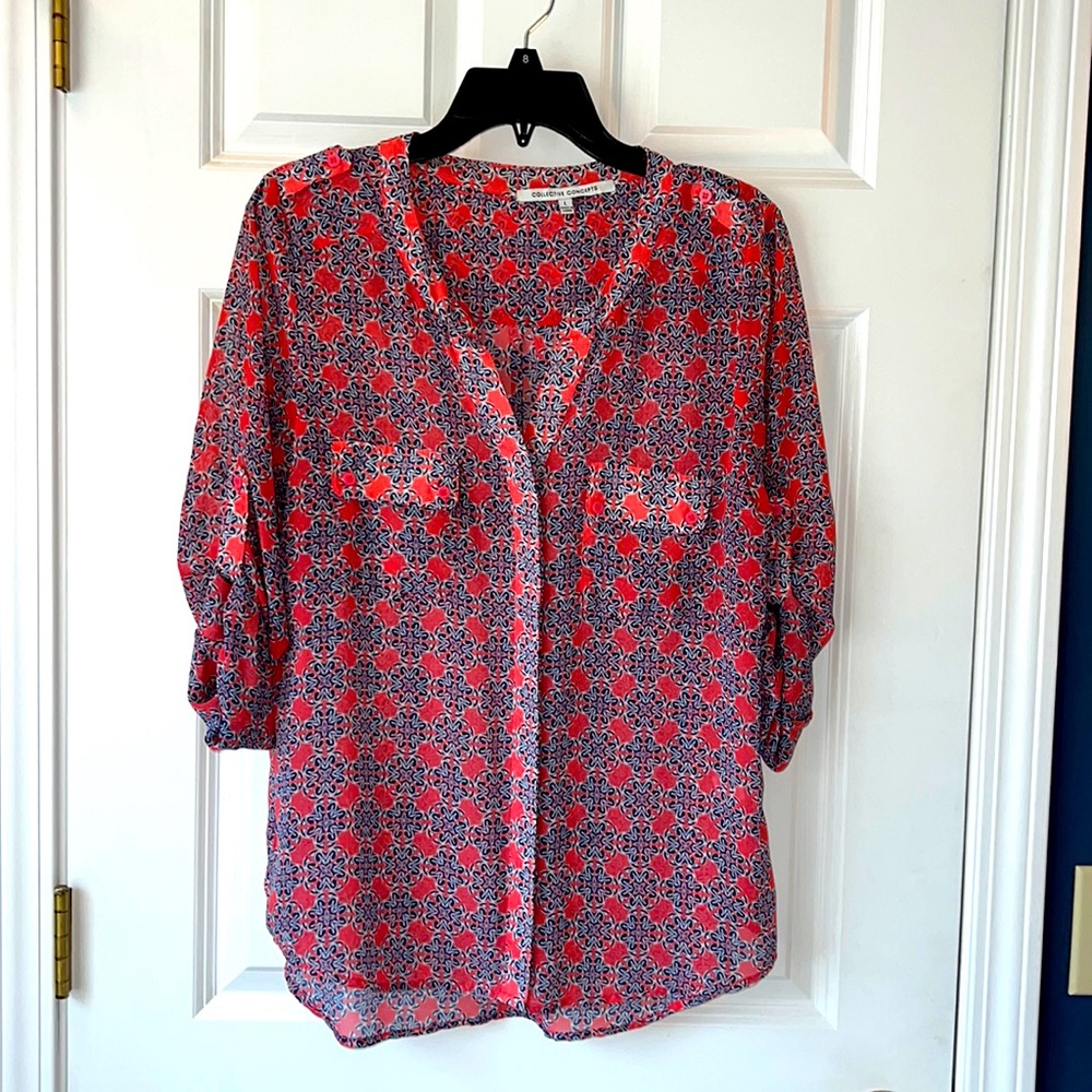 Lovely navy and rose colored blouse with button detailing and roll sleeves.